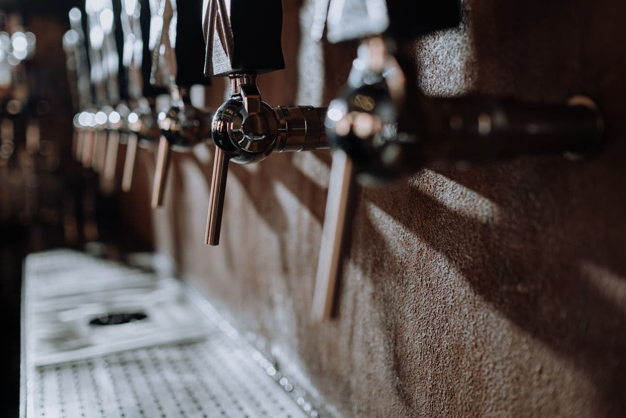 Beer taps in a craft brewery taproom